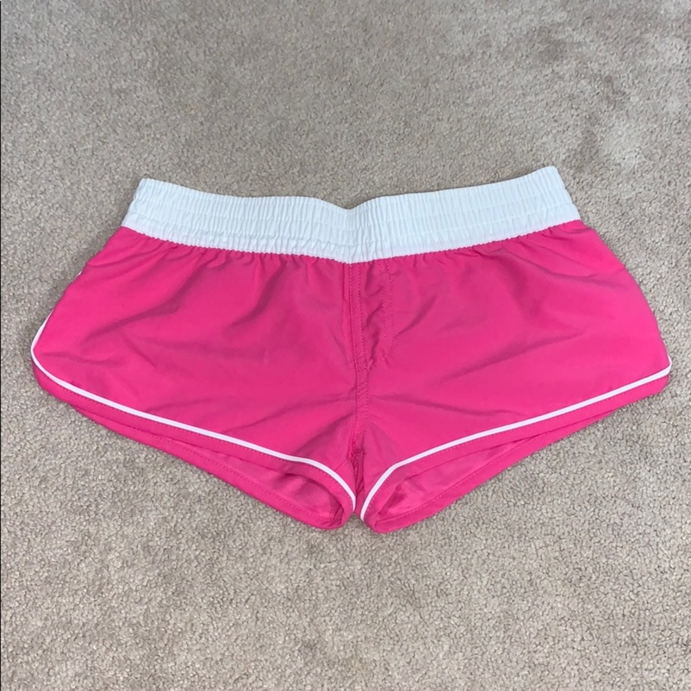 Pink athletic running shorts